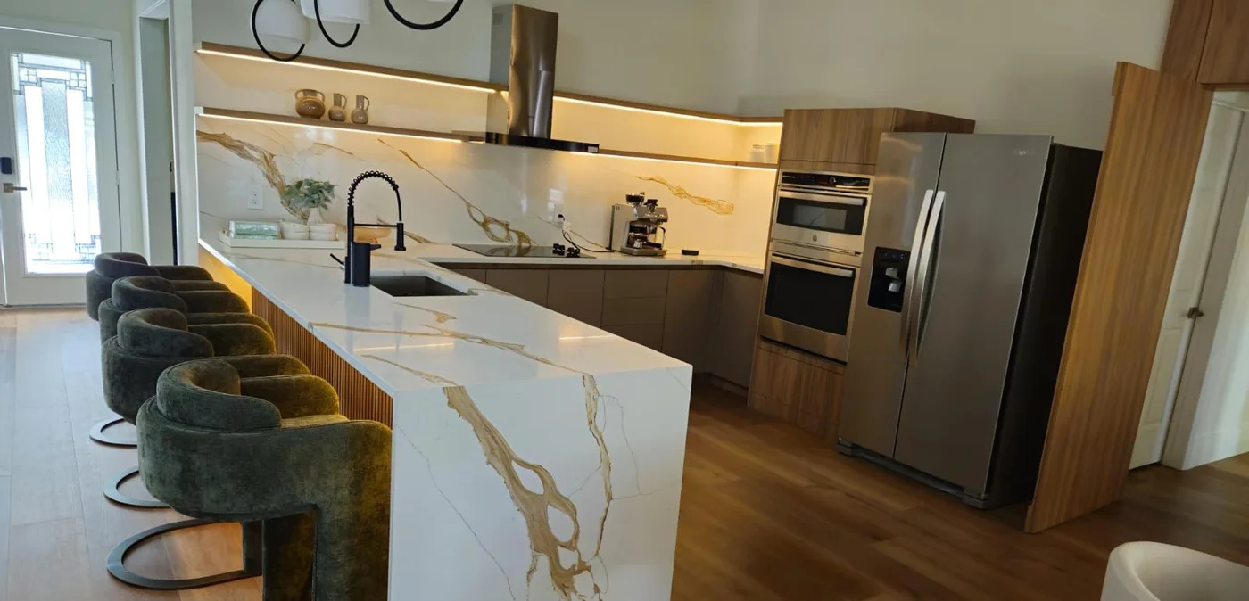 Finished kitchen with a stone island and perimeter countertops
